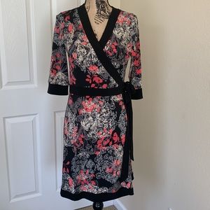 Alfani petite super cute wrap dress. Beautiful floral design, trimmed w black
